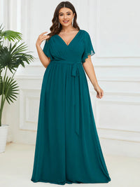 Teal plus sized bridesmaid dress with v-neck and a-line.