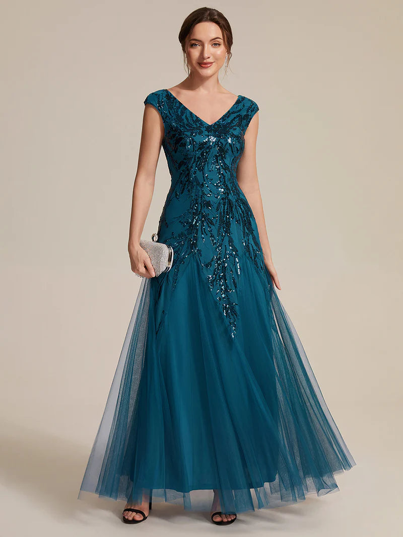 Teal sequin and tulle mother of the bride dress with short sleeve.