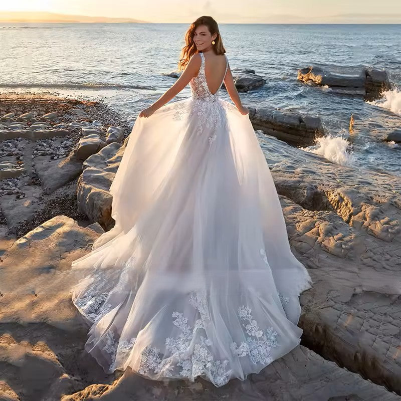 Wedding dress in ivory with tulle and applique detail.