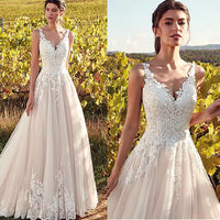 Lace & tulle vintage style wedding dress with lace up back.