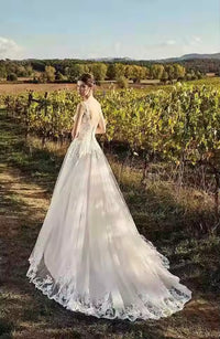 Lace & tulle vintage style wedding dress with lace up back.
