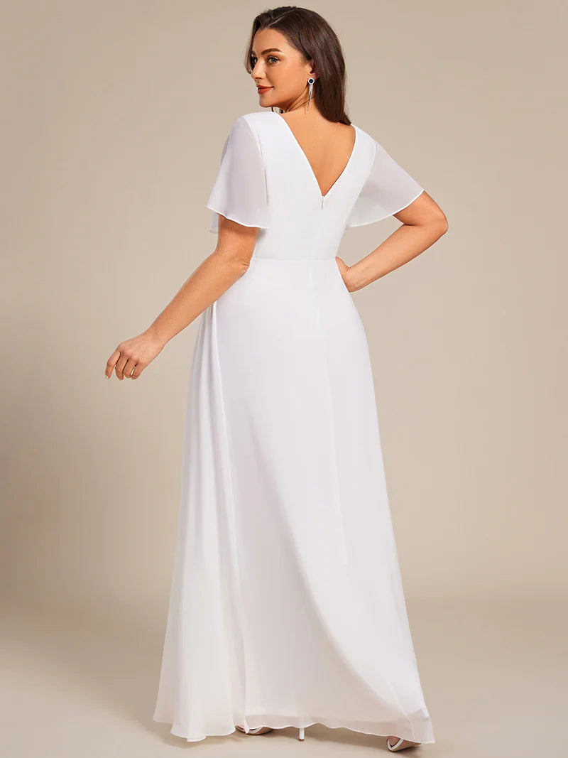 White plus size formal dress with sleeves and a hidden split.
