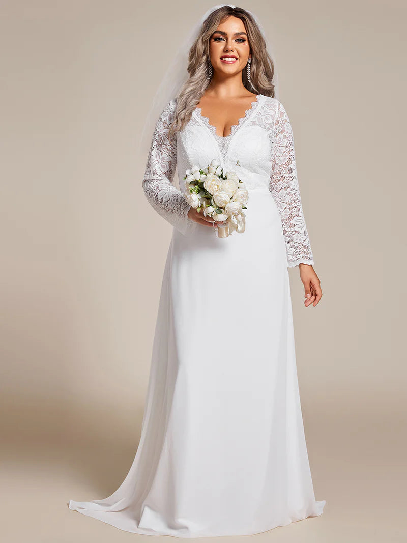 White plus sized wedding dress with long sleeves and laced back.