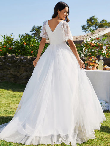 White Plus Size Wedding Dress with short lace sleeve and tulle skirt.