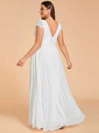 White plus size wedding dress with lace applique detail and chiffon skirt.