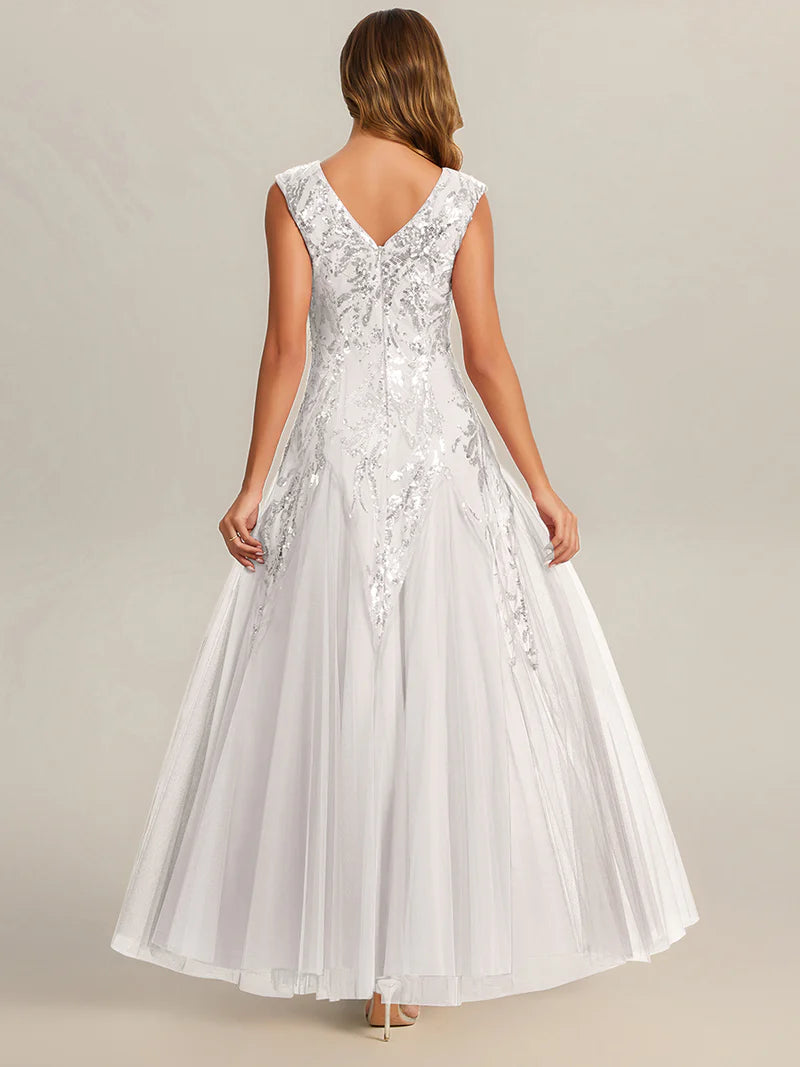 White sequin and tulle mother of the bride dress with short sleeve.