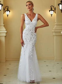 White wedding dress with fishtail and sequins.