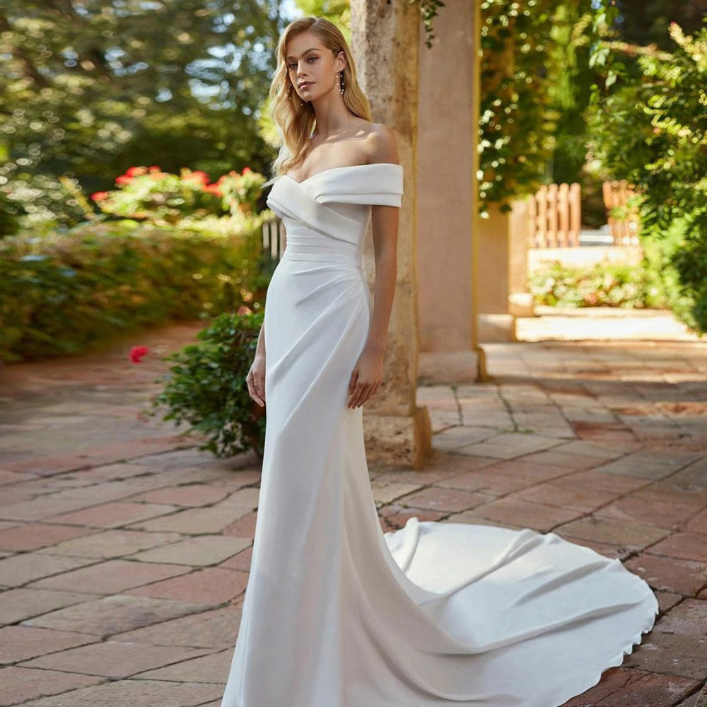 White wedding dress with off the shoulder mermaid tail and satin. Available in plus size.