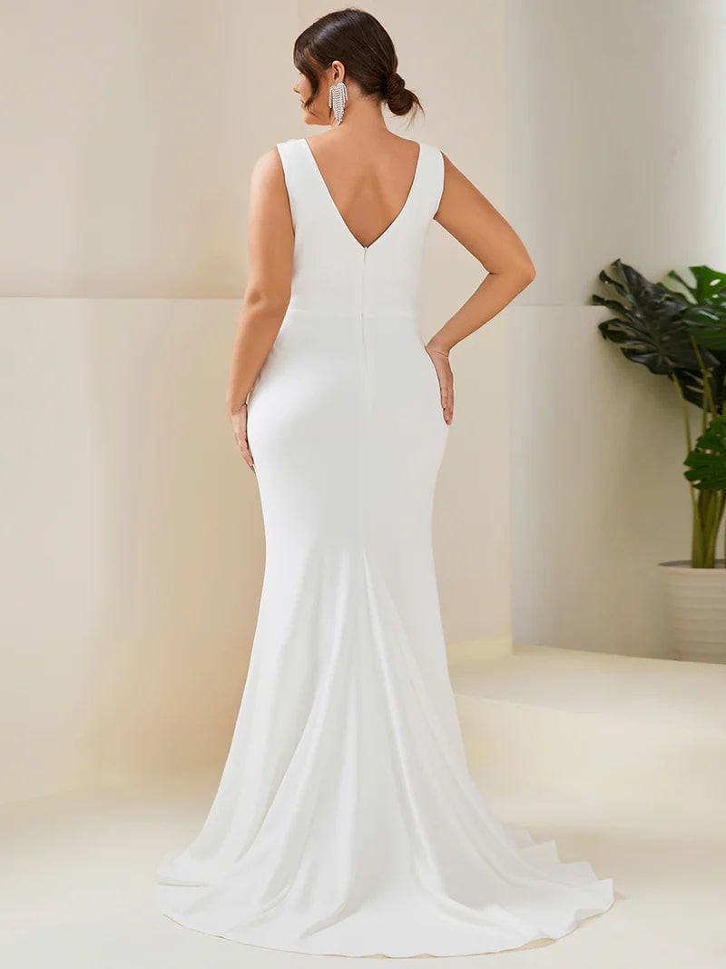 White plus sized wedding dress with mermaid tail, sleeveless, split and v-neck.