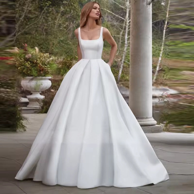 White or Ivory wedding dress with pockets in satin with square neck and train.