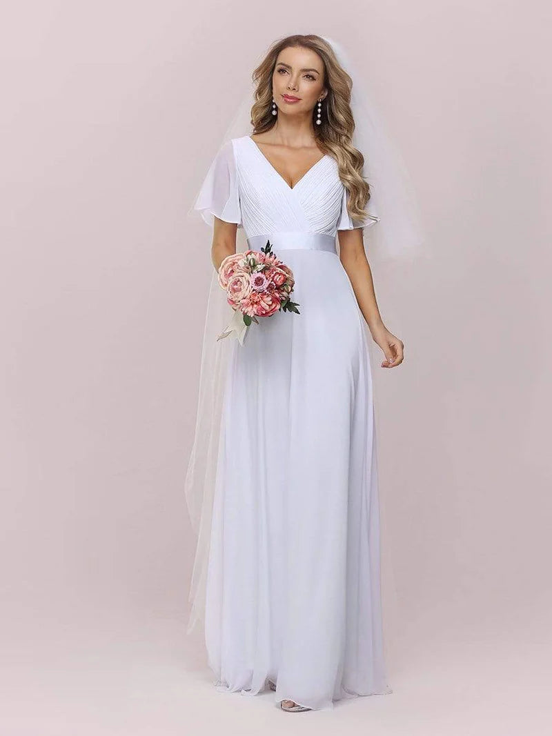 White chiffon wedding dress with satin band, available in plus size.